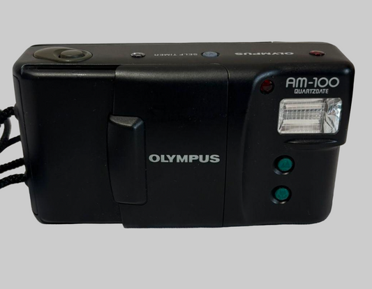 Black Olympus camera on a white background
